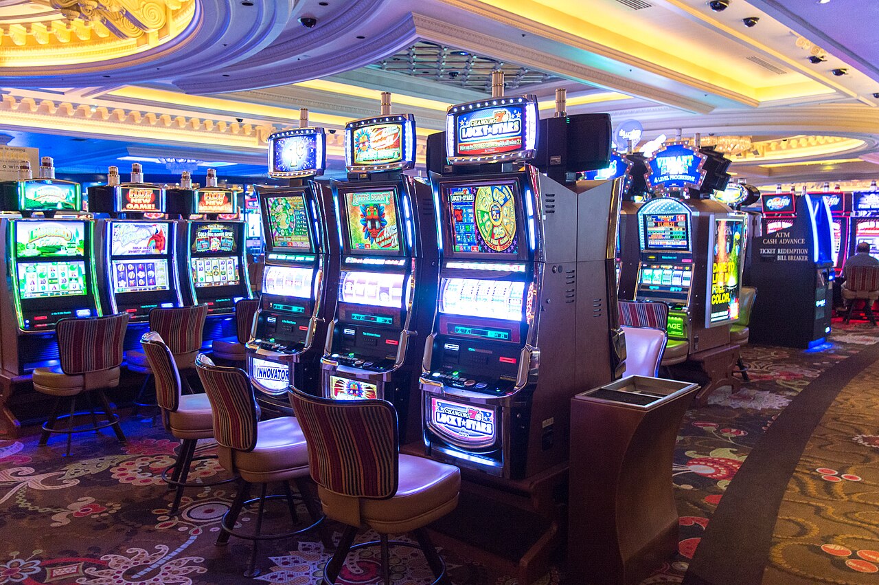 A row of slot machines on a Las Vegas casino floor